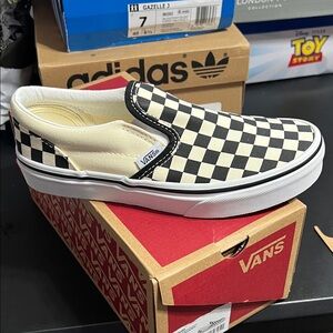 Vans Black and Cream Checkerboard Slip-Ons